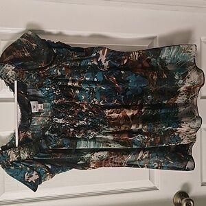 This is a 1x plus sized green and brown multicolored womens blouse